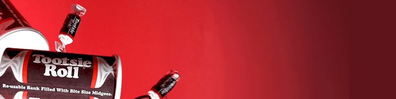 Tootsie roll candies in red background
