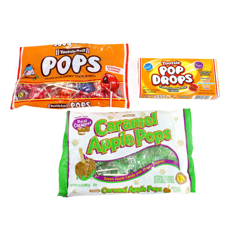 Three packages of Tootsie Pop candy on a white background