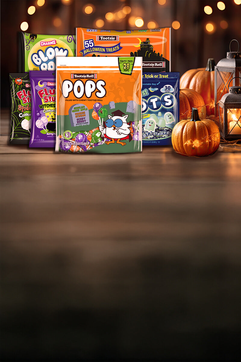 Various Tootsie products in the Halloween theme background