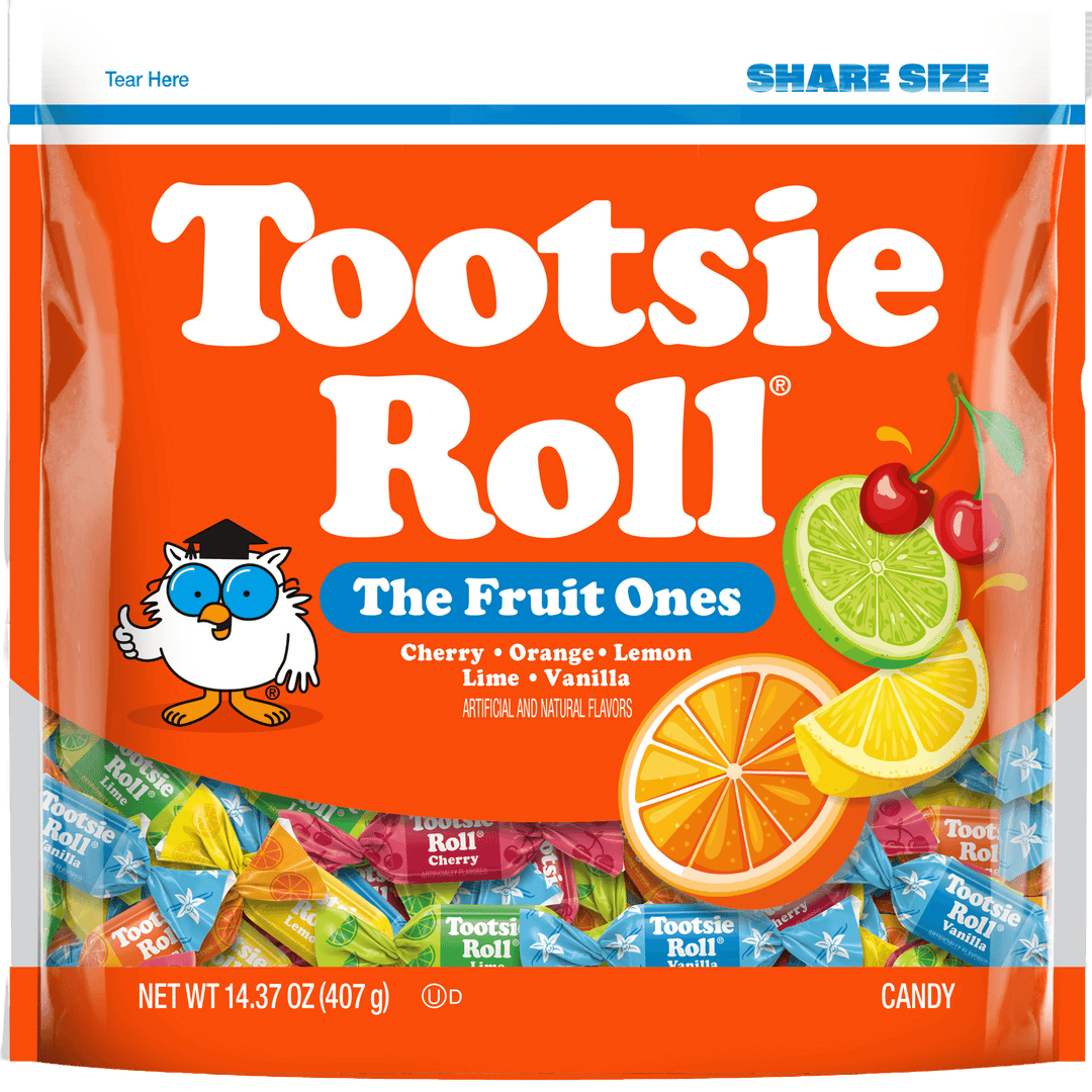 A bag of Tootsie Roll The Fruit Ones assorted candy in a bright orange package with large white brand text, a cartoon owl, and fruit illustrations including cherry, lime, orange, and vanilla.