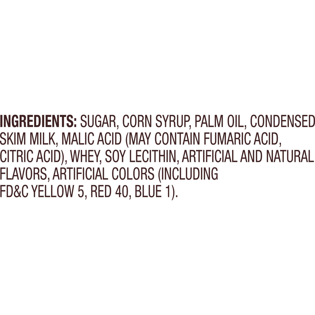 A close-up of a product ingredients list printed in dark brown text on a plain white background, starting with the word 'INGREDIENTS:' and listing sugar, corn syrup, palm oil, condensed skim milk, and additives.