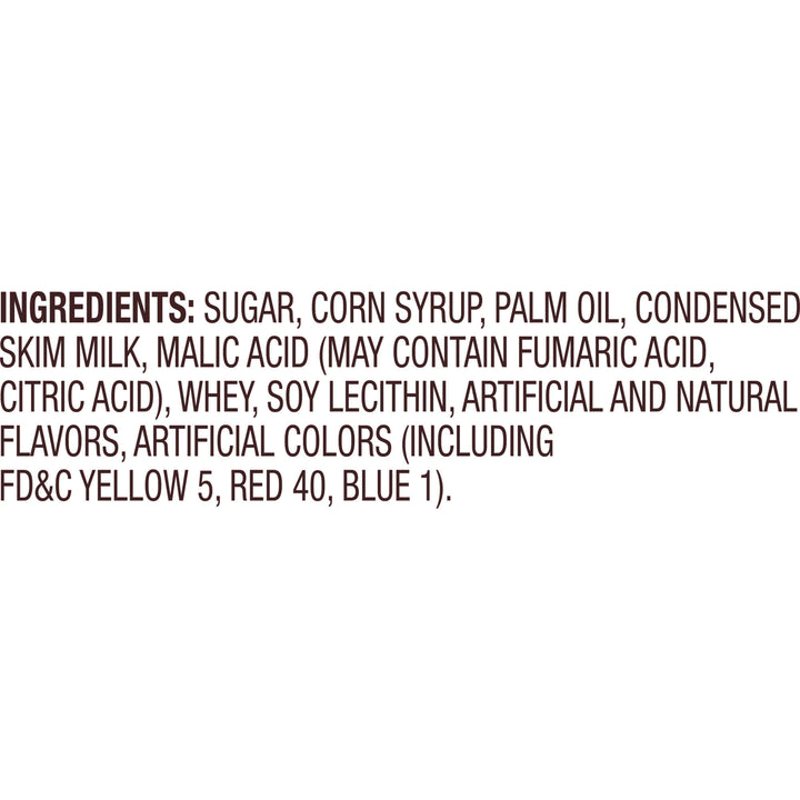 A close-up of a product ingredients list printed in dark brown text on a plain white background, starting with the word 'INGREDIENTS:' and listing sugar, corn syrup, palm oil, condensed skim milk, and additives.