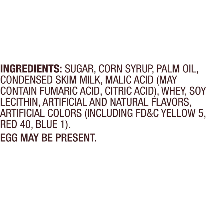 A text-only label showing the ingredients list in dark brown lettering on a white background, including sugar, corn syrup, palm oil, condensed skim milk, malic acid, whey, soy lecithin, artificial and natural flavors, artificial colors, and an egg may be present.