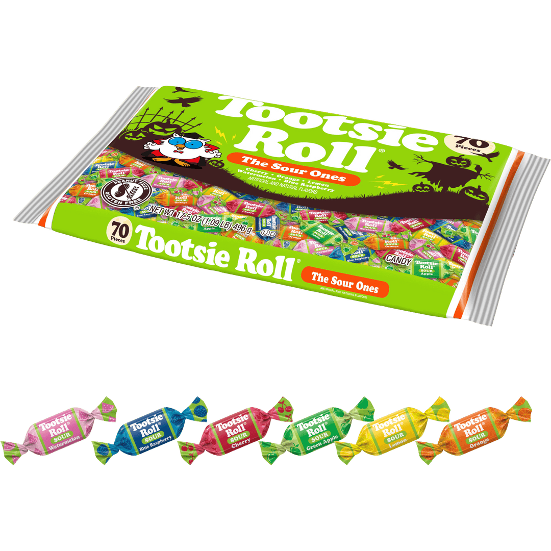 A large package of Tootsie Roll 'The Sour Ones' candy is shown on a white background, with ten individually wrapped Tootsie Roll candies lined up along the bottom. The main package is bright green with multicolored candy imagery and branding, and the small wrapped candies below display different flavor colors.