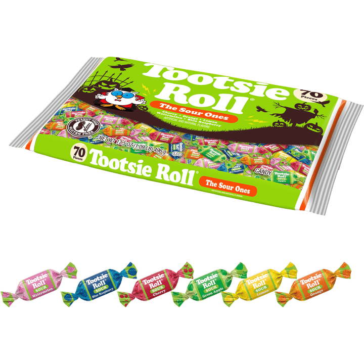A large package of Tootsie Roll 'The Sour Ones' candy is shown on a white background, with ten individually wrapped Tootsie Roll candies lined up along the bottom. The main package is bright green with multicolored candy imagery and branding, and the small wrapped candies below display different flavor colors.