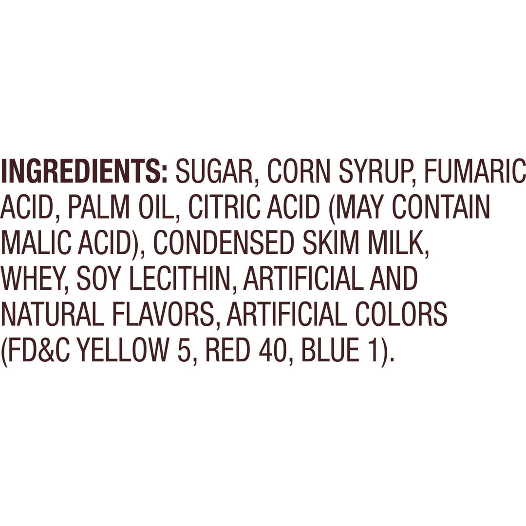 A text-only image with a white background and dark brown text listing ingredients, including sugar, corn syrup, fumaric acid, palm oil, citric acid, condensed skim milk, whey, soy lecithin, artificial and natural flavors, and artificial colors (FD&C yellow 5, red 40, blue 1).