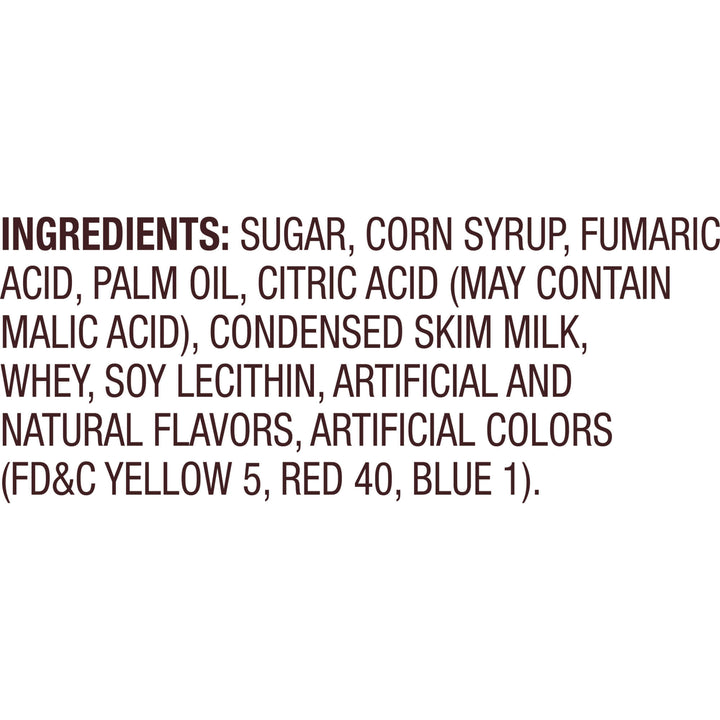 A text-only image with a white background and dark brown text listing ingredients, including sugar, corn syrup, fumaric acid, palm oil, citric acid, condensed skim milk, whey, soy lecithin, artificial and natural flavors, and artificial colors (FD&C yellow 5, red 40, blue 1).