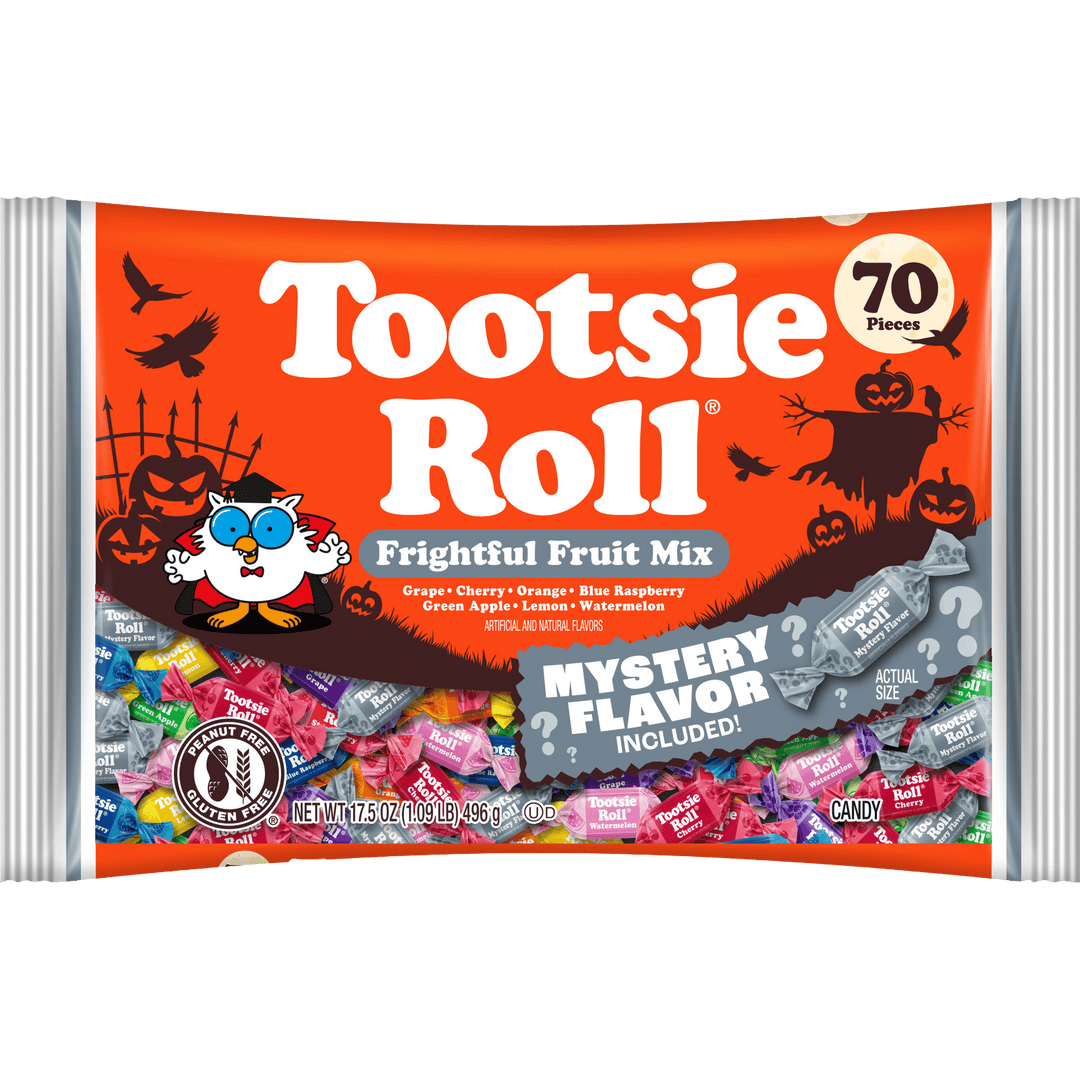 A bag of Tootsie Roll Frightful Fruit Mix Halloween candy, featuring an orange wrapper with spooky illustrations, a cartoon owl, and a gray banner indicating a mystery flavor included.