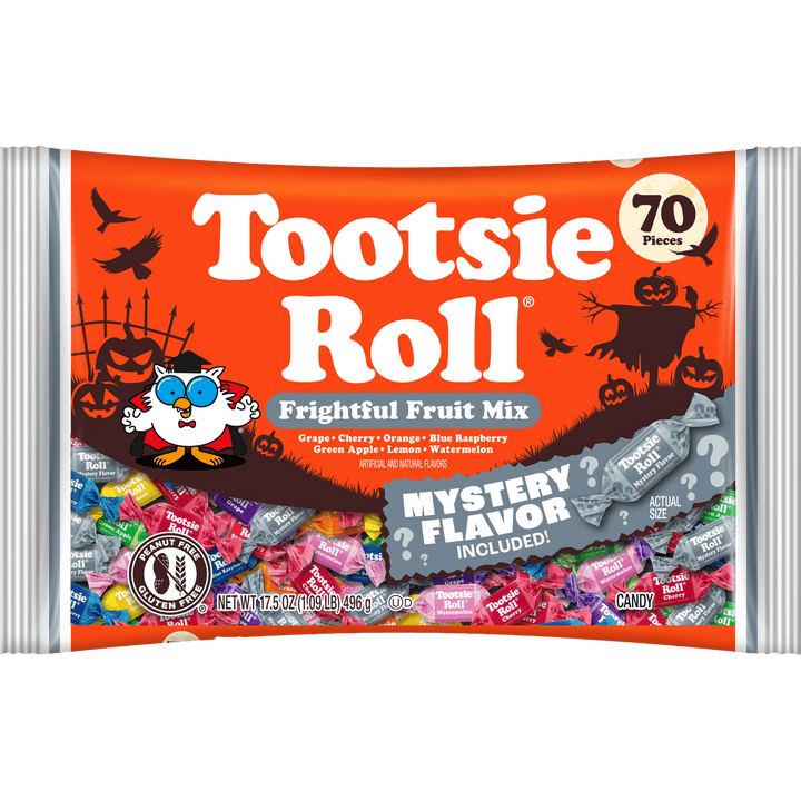 A bag of Tootsie Roll Frightful Fruit Mix Halloween candy, featuring an orange wrapper with spooky illustrations, a cartoon owl, and a gray banner indicating a mystery flavor included.