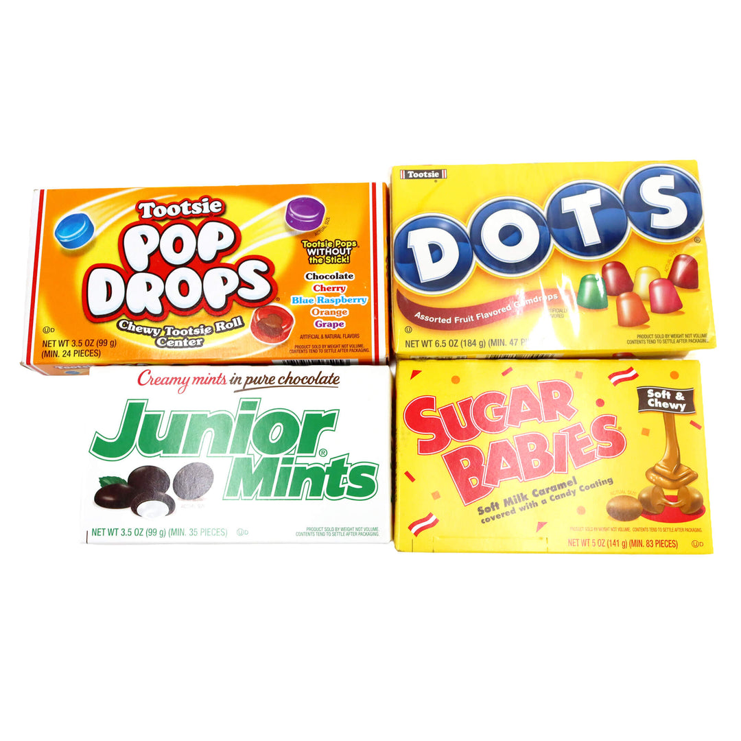 Four boxes of different candy brands on a white background