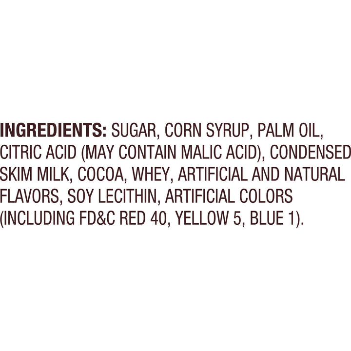 Ingredients list with black text on white background detailing sugar, corn syrup, palm oil, citric acid, milk, cocoa, whey, flavors, soy lecithin, and colors.