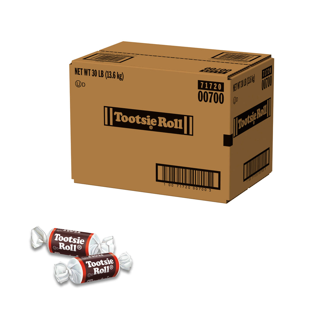 Large cardboard box of Tootsie Roll candy with two individual rolls displayed below on a white background.
